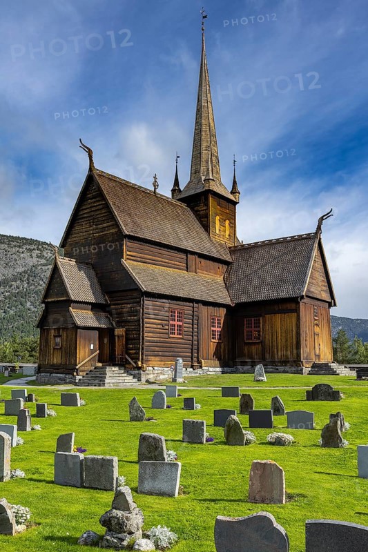 Lom Stave Church (Lom stavkyrkje) with cemetery in the foreground, Lom, Norway