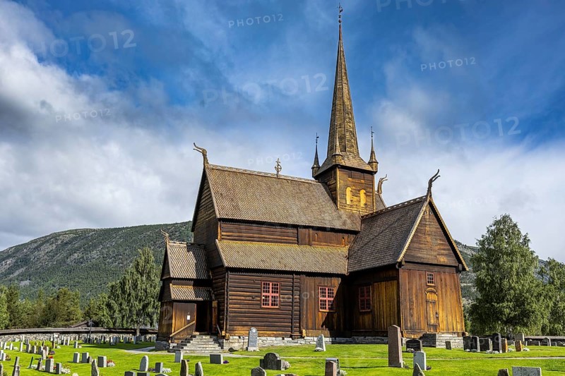 Lom Stave Church (Lom stavkyrkje) with cemetery in the foreground, Lom, Norway