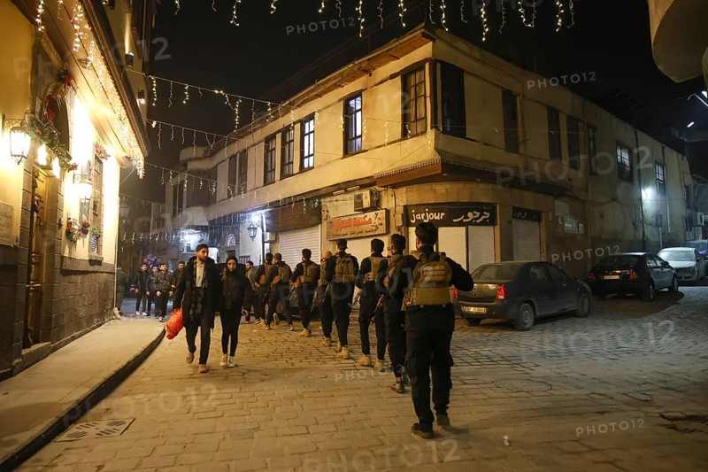 In Damascus, Syria, on December 25, 2025, festive scenes filled the streets and churches of the Bab Touma district, where thousands of people gathered to celebrate Christmas Eve amid holiday decorations and lights, Damascus, Damascus, Syria