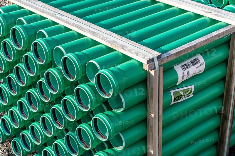 Symbolic picture construction site, sewage pipes for dirty and rainwater, for installation in the ground, plastic pipes, made of polypropylene, storage on a construction site