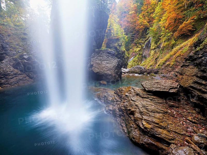 Waterfall mountain list in autumn-colored surroundings, Linthal, Klausenpass, Canton of Glarus, Switzerland