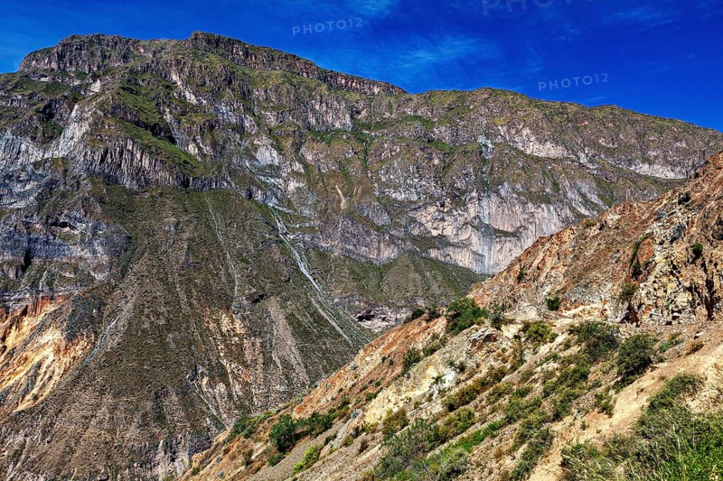 View of rocky mountain landscape under blue sky, The landscape of Colca Canyon in the Aden of Peru