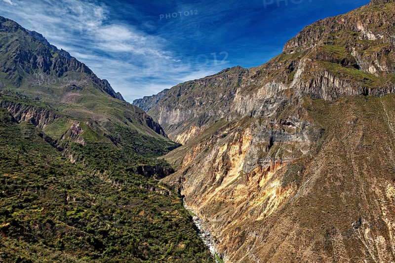 Mountain landscape with deep gorges under bright blue sky, The landscape of Colca Canyon in the Aden of Peru