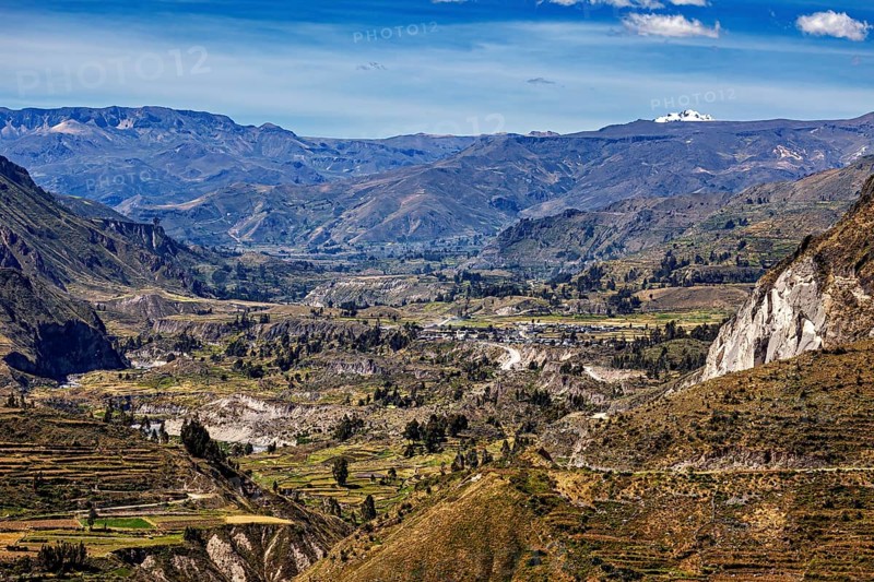 Mountainous landscape with green valleys and blue sky, The landscape of Colca Canyon in the Aden of Peru