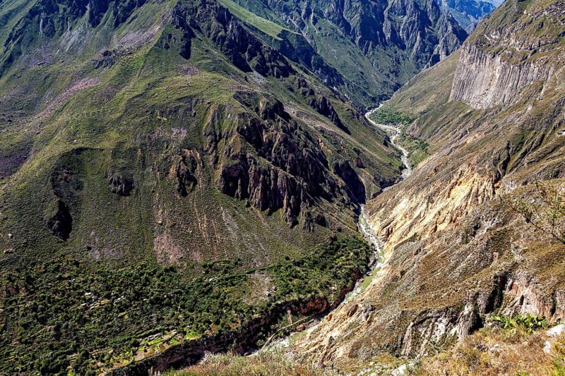 Impressive gorge in a far-reaching mountain landscape under blue skies, The landscape of Colca Canyon in the Aden of Peru