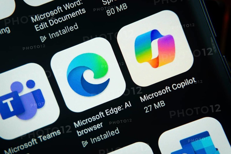 Dhaka, Bangladesh- 27 July 2025: Close-up of smartphone screen showing the Microsoft Edge, Microsoft Copilot, Microsoft Teams app icon with a dark interface
