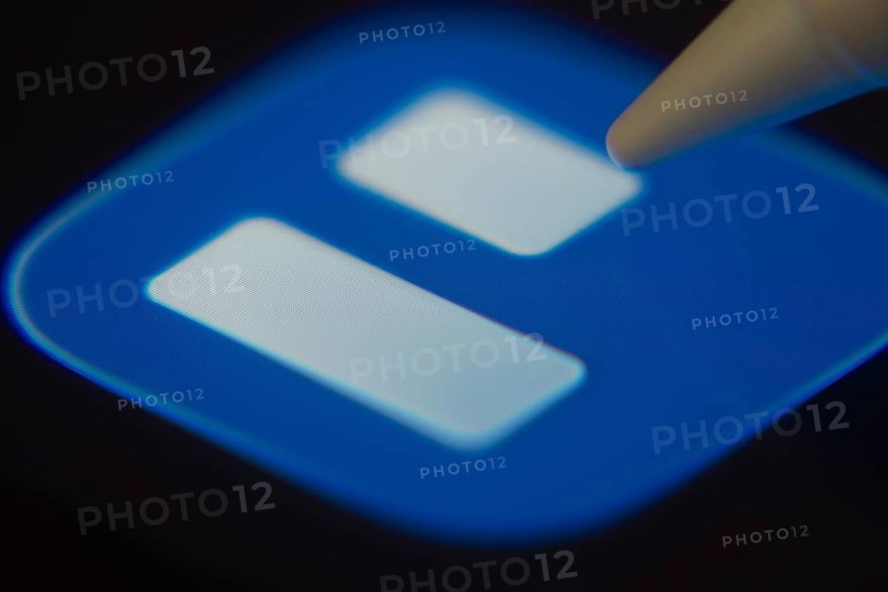 Dhaka, Bangladesh- 06 Dec 2025: Close-up of the Trello app on a screen with a stylus pointing at it