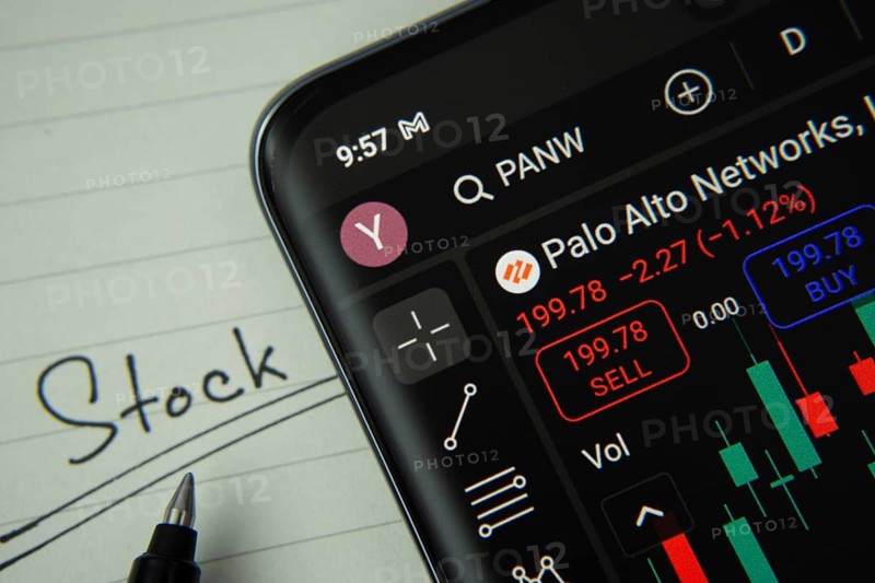 Dhaka, Bangladesh- 20 June 2025: Palo Alto stock trading information on smartphone screen with a handwritten note