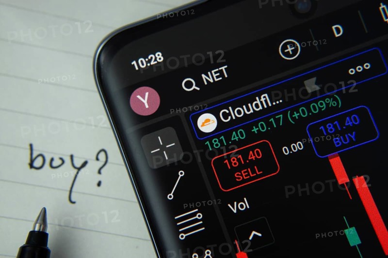 Dhaka, Bangladesh- 20 June 2025: Cloudflare stock trading details displayed on smartphone with handwritten note