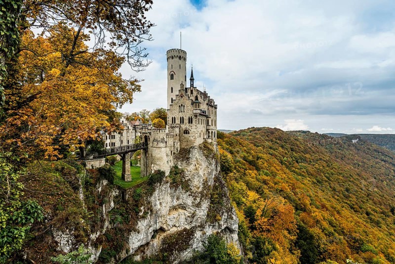 Castle and autumnal forest, Lichtenstein Castle, Honau, Echaz Valley, Swabian Jura, Baden-Württemberg, Germany
