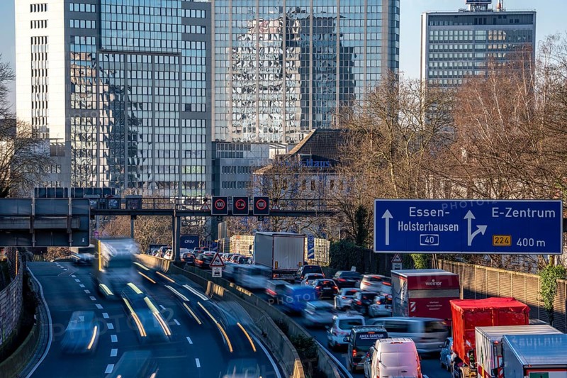 The A40 motorway, Ruhrschnellweg, in Essen, city skyline, Evonik office building, traffic jam in the westbound lane, Duisburg, slow traffic, North Rhine-Westphalia, Germany