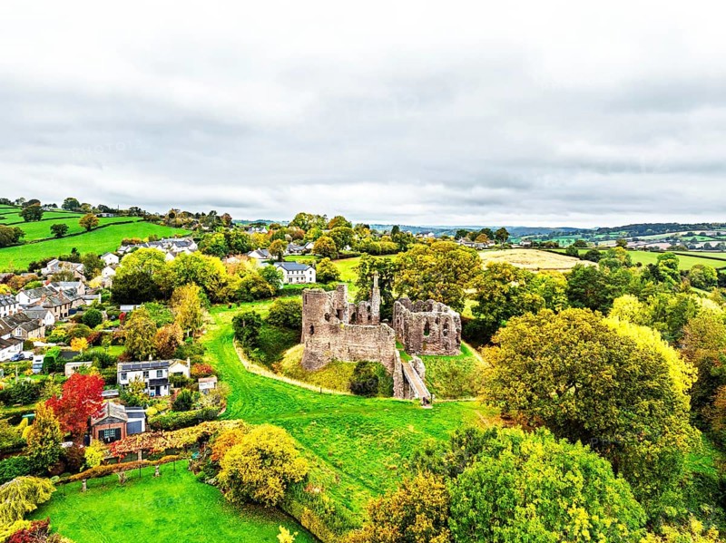 Autumn Colours over ruins of Grosmont Castle from a drone, Grosmont, Monmouthshire, Wales, UK