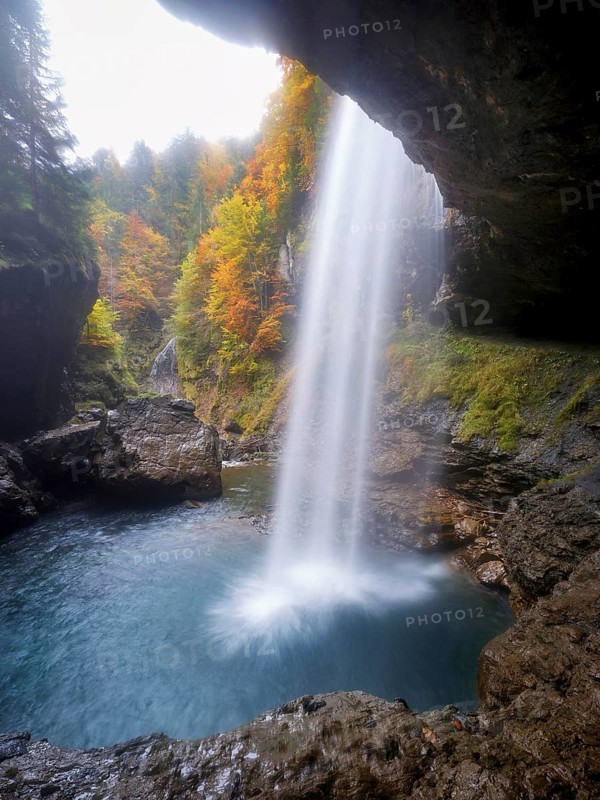 Waterfall mountain list in autumn-colored surroundings, Linthal, Klausenpass, Canton of Glarus, Switzerland