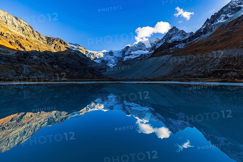 The Moiry glacier and mountain peaks are reflected in Lac de Chateaupre, Val d'Anniviers, Valais Alps, Canton of Valais, Switzerland