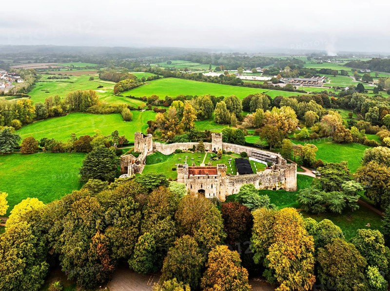 Autumn Colours over ruins of Caldicot Castle from a drone, Caldicot, Monmouthshire, Wales, UK