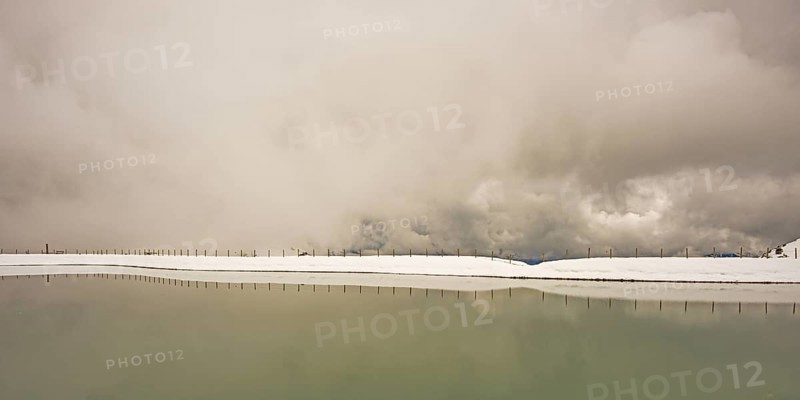 Another onset of winter in May, Riezler Alpsee, an artificially created lake, snow pond, feeds the snow cannons that completely snow the slopes of the Fellhorn and Kanzelwand cable cars, Allgäu Alps, Vorarlberg, Austria