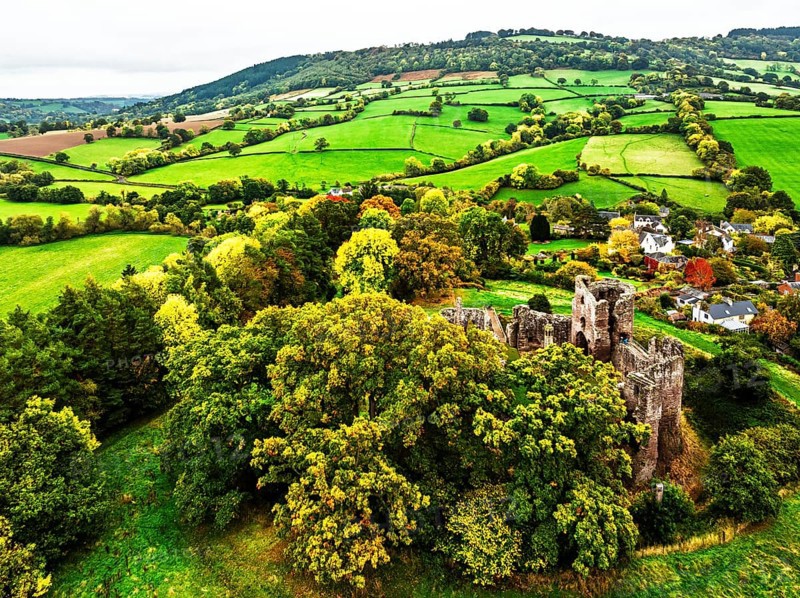 Autumn Colours over ruins of Grosmont Castle from a drone, Grosmont, Monmouthshire, Wales, UK