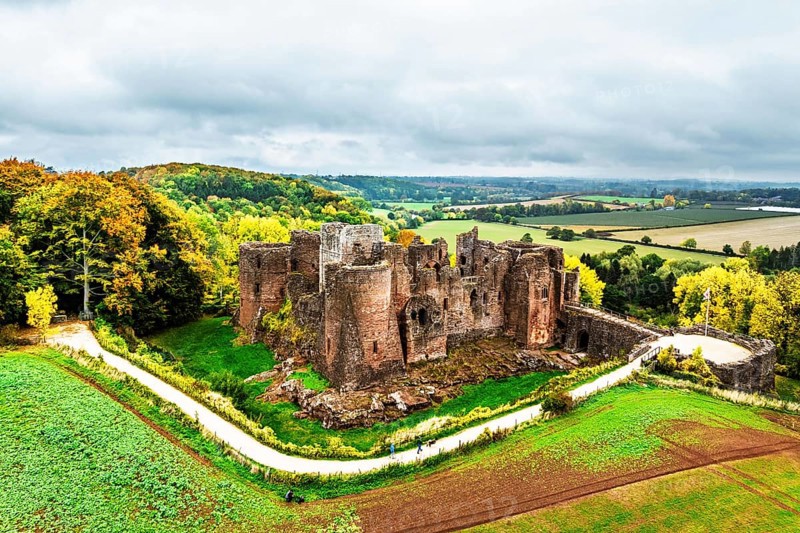 Autumn Colours over ruins of Goodrich Castle and River Wye from a drone, Goodrich, Herefordshire, England, United Kingdom