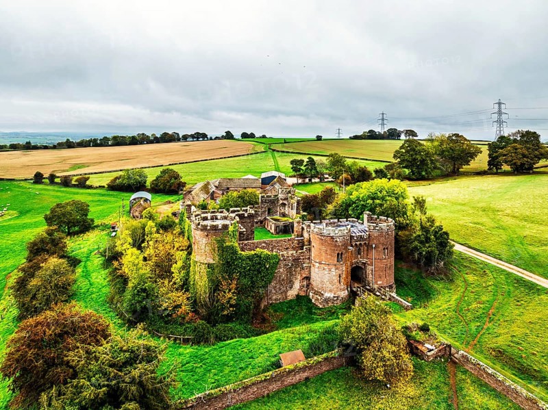 Autumn Colours over ruins of Pembridge Castle or Newland Castle from a drone, Herefordshire, England, United Kingdom