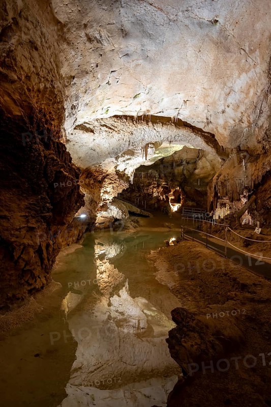 Stalactites and stalagmites, reflection in a small underground lake, rock formations in a stalactite cave, Grotta del Fico, Gulf of Orosei, Baunei, Sardinia, Italy
