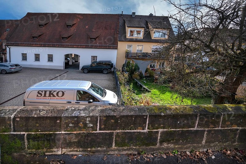 Historic city wall built in the 14th century, old town houses behind, Lauf an der Pegnitz, Middle Franconia, Bavaria, Germany