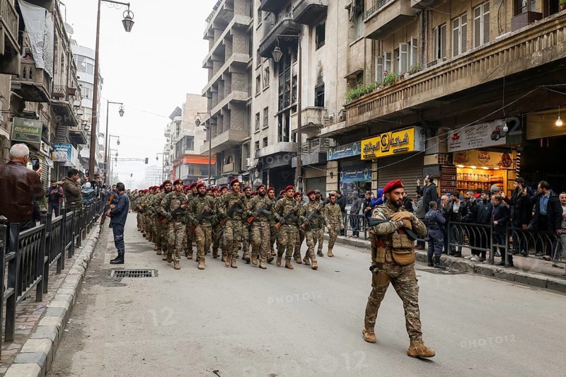 Aleppo, Syria – December 08, 2025: The Syrian Army and Public Security forces hold a military parade marking the first anniversary of the Syrian revolution's victory and the fall of the Assad regime, attended by thousands of people, Aleppo, Aleppo, Syria