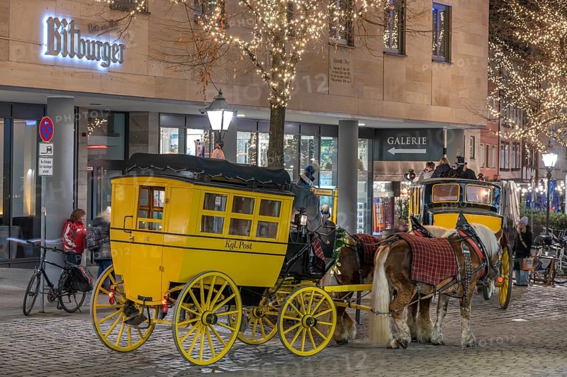Historic stagecoach rides with horseback during the Nuremberg Christmas Market, Nuremberg, Middle Franconia, Bavaria, Germany