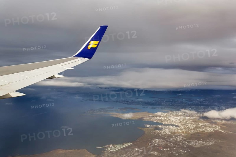 Wing, airplane, Icelandair airline logo, flying to Boston, view of Reykjavik, aerial view, Iceland