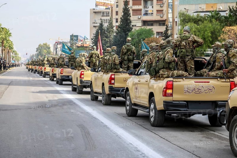 Damascus, Syria – December 08, 2025: A military parade by Syrian army units marking the first anniversary of liberation and the change of Assad's regime, held in Umayyad Square in central Damascus, attended by thousands of people, Damascus, Damascus, Syria