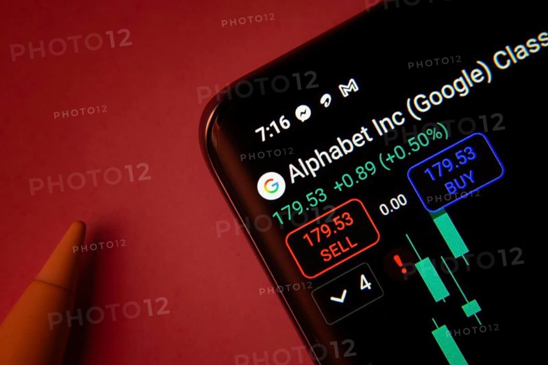 Dhaka, Bangladesh- 08 Sep 2025: Close-up of a phone screen showing Alphabet Inc stock market data with a candlestick chart