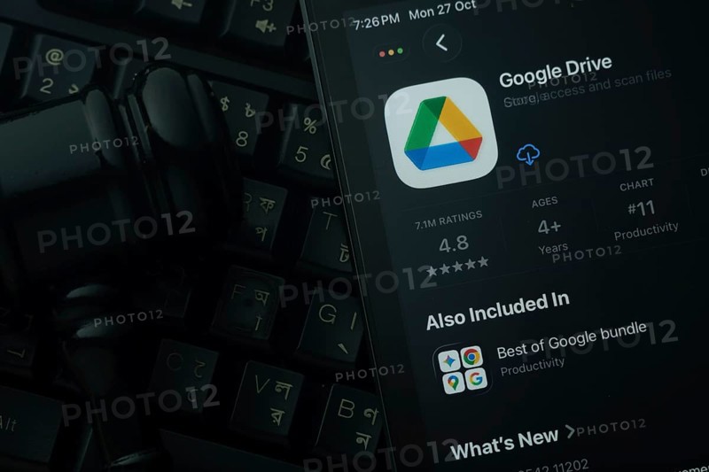 Dhaka, Bangladesh- 28 Oct 2025: An iPad displaying the Google Drive app against a judge's gavel and dark keyboard background