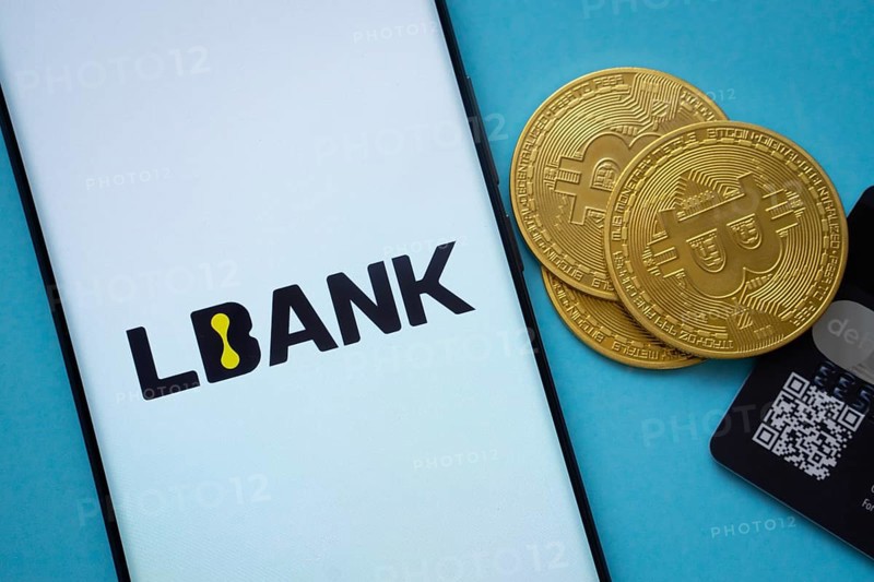 Dhaka, Bangladesh- 03 Sep 2025: Lbank logo on smartphone screen near Bitcoin coin and QR code on blue background