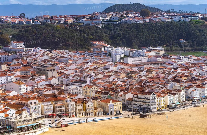 View from Leuct Tower towards orange tiled roofs in the town of Nazare, Estremadura, Portugal