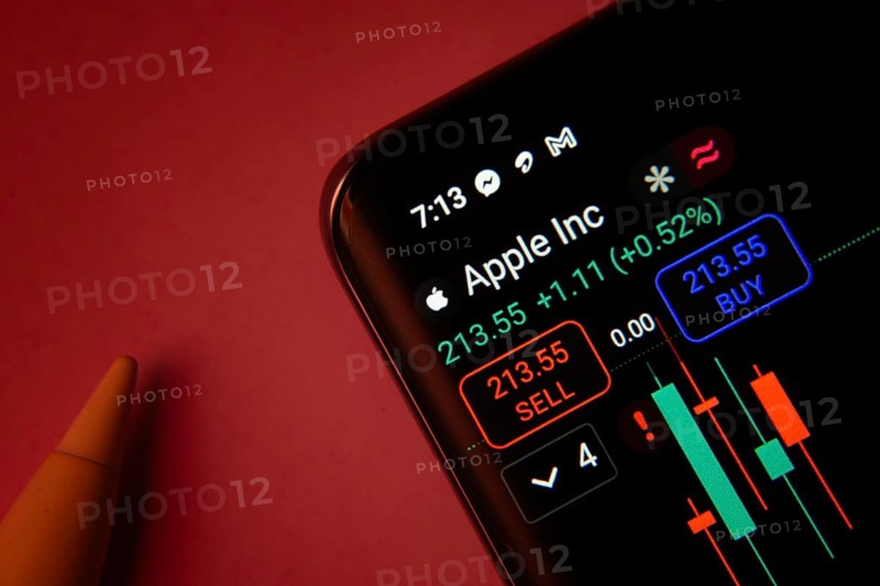 Dhaka, Bangladesh- 08 Sep 2025: Close-up of a phone screen showing Apple Inc stock market data with a candlestick chart