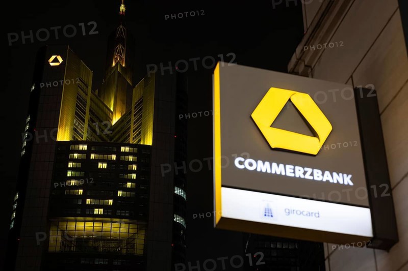 A yellow heart glows on the façade of the Commerzbank Tower in Frankfurt am Main at Christmas time in the evening, Frankfurt am Main, Hesse, Germany
