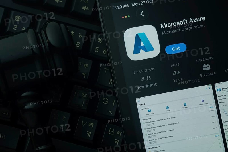 Dhaka, Bangladesh- 28 Oct 2025: An iPad displaying the Microsoft Azure app against a judge's gavel and dark keyboard background