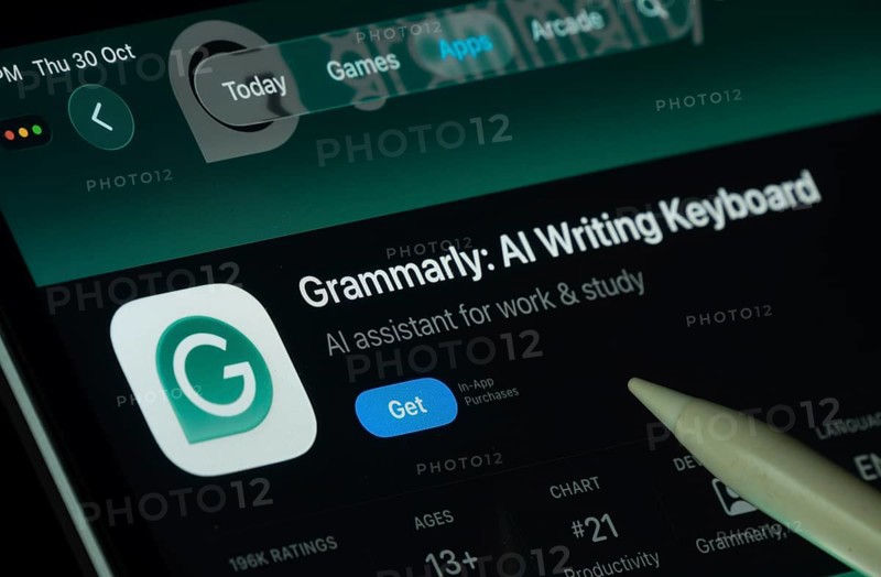 Dhaka, Bangladesh- 30 Oct 2025: Grammarly app displayed on a iPad screen in dark mode with a digital pen pointing at it