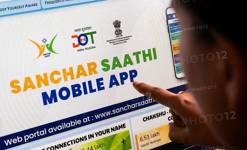In this photo illustration, a person downloads the Sanchar Saathi mobile application on an iPhone, in New Delhi, India on 3 December 2025. Sanchar Saathi is officially developed and operated by the Department of Telecommunications (DoT), Government of India as part of its citizen-protection and telecom-security initiative