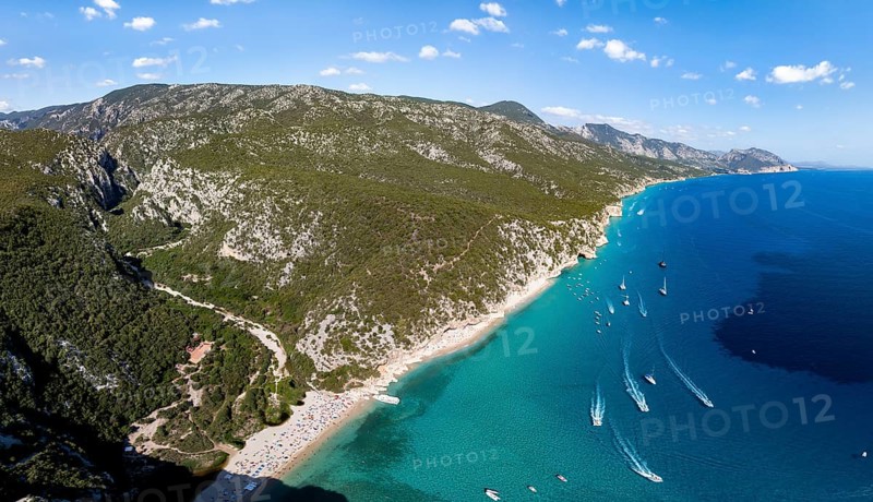 Picturesque rocky coast, cliffs and Cala Luna beach, aerial view, Golfo di Orosei, Baunei, Sardinia, Italy