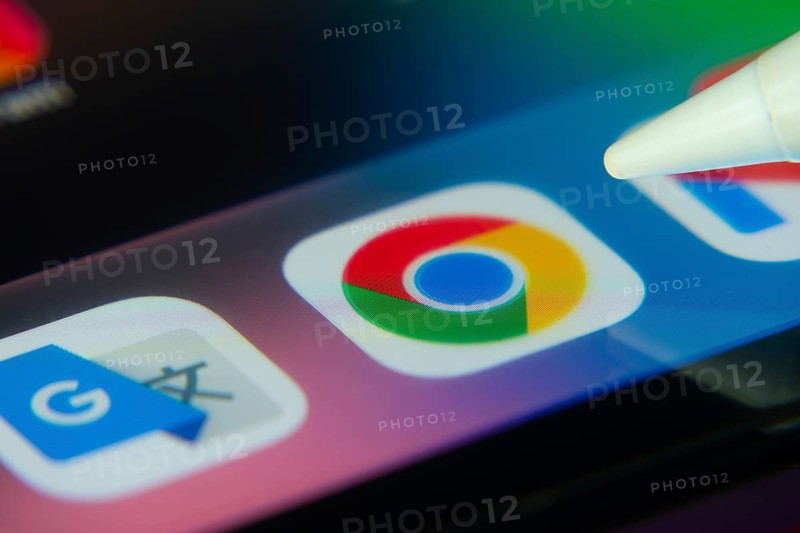 16 Nov 2025- Dhaka, Bangladesh: Stylus touching the Google Chrome app icon on a smartphone screen