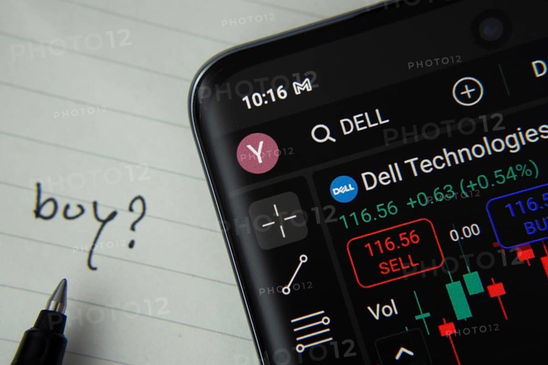 Dhaka, Bangladesh- 20 June 2025: Dell technologies stock trading details displayed on smartphone with handwritten note