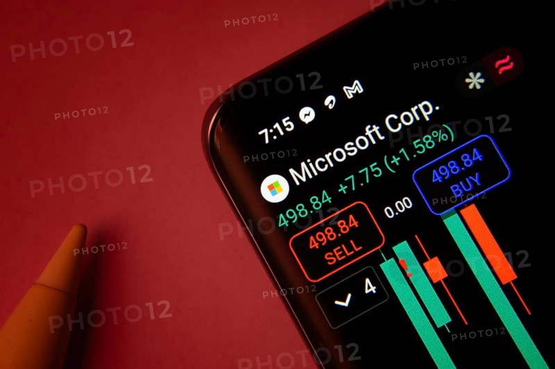 Dhaka, Bangladesh- 08 Sep 2025: Close-up of a phone screen showing Microsoft Corporation stock market data with a candlestick chart