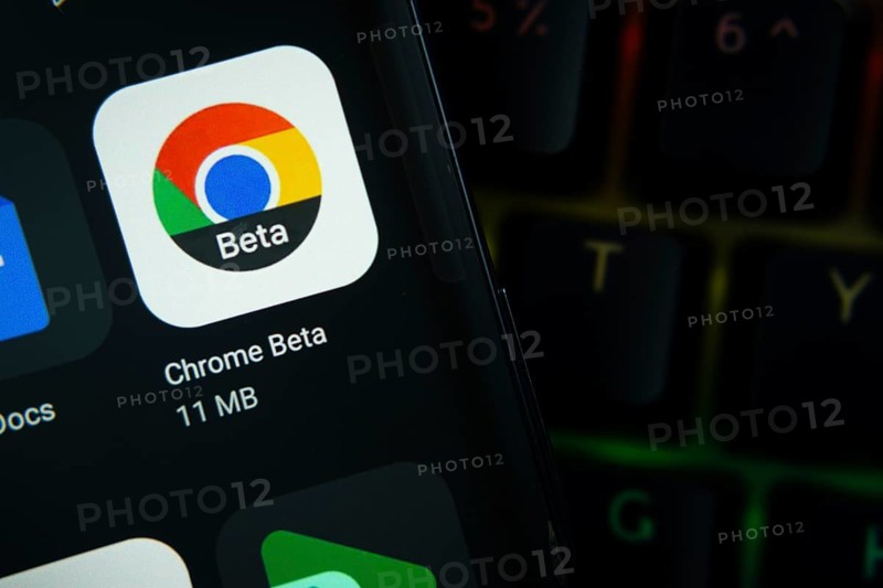 Dhaka, Bangladesh- 27 July 2025: Close-up of smartphone screen showing the Google Chrome Beta app icon with a dark interface
