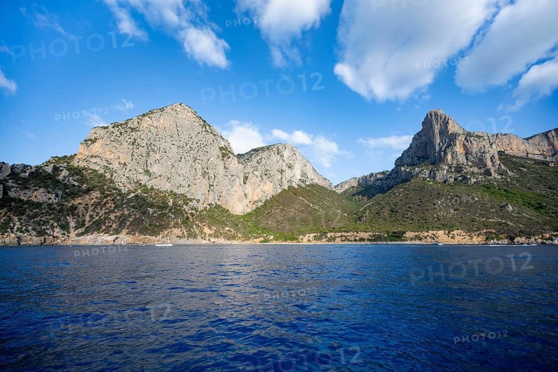 Picturesque rocky coast, cliffs and blue sea, Golfo di Orosei, Baunei, Sardinia, Italy