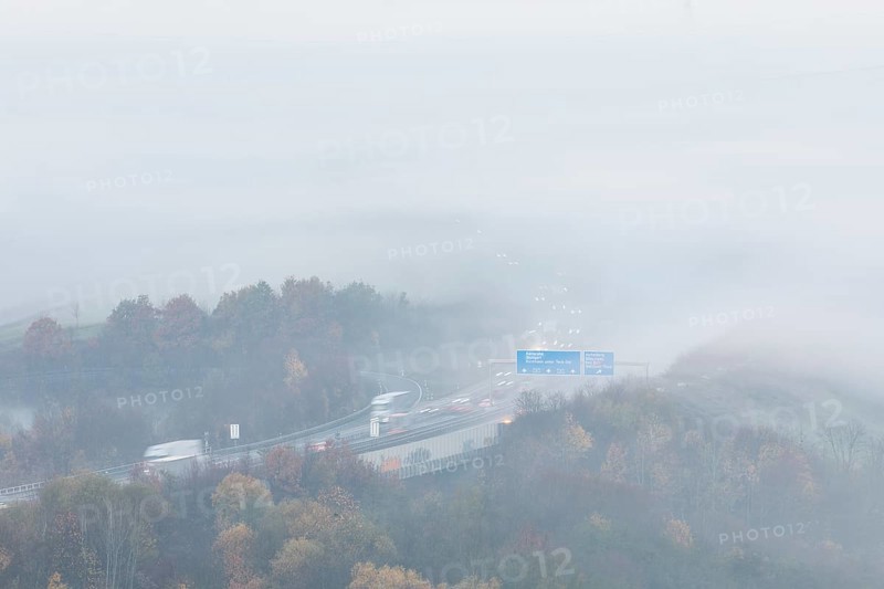Aichelberg Alb climb of the A8 in thick fog on an autumn morning. Lkr. Göppingen, Baden-Württemberg, Germany