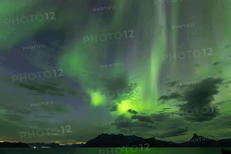 Northern lights at dawn over Sørfolda Fjord near Kjerringøy between Bodø and Sørfold in Norway