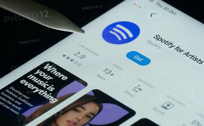 Dhaka, Bangladesh- 30 Oct 2025: Spotify for Artists app on a iPad screen with a pen pointing at the install option