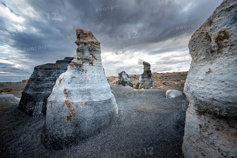 Eroded rock formations, volcanic landscape with dramatic cloudy skies, Ciudad Estratificada or Los Roferos, Antigua Rofera de Teseguite, Lanzarote, Canary Islands, Spain