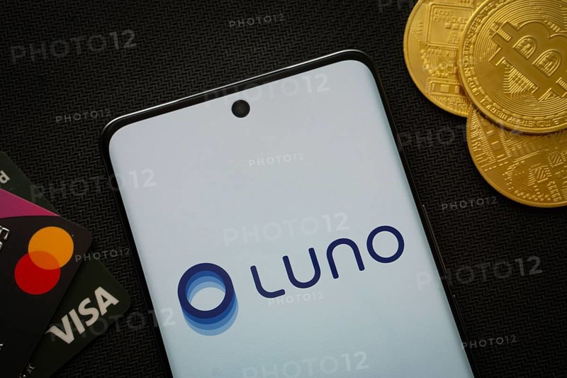Dhaka, Bangladesh- 06 Sep 2025: Smartphone displaying Luno logo surrounded by Bitcoin coins and payment cards