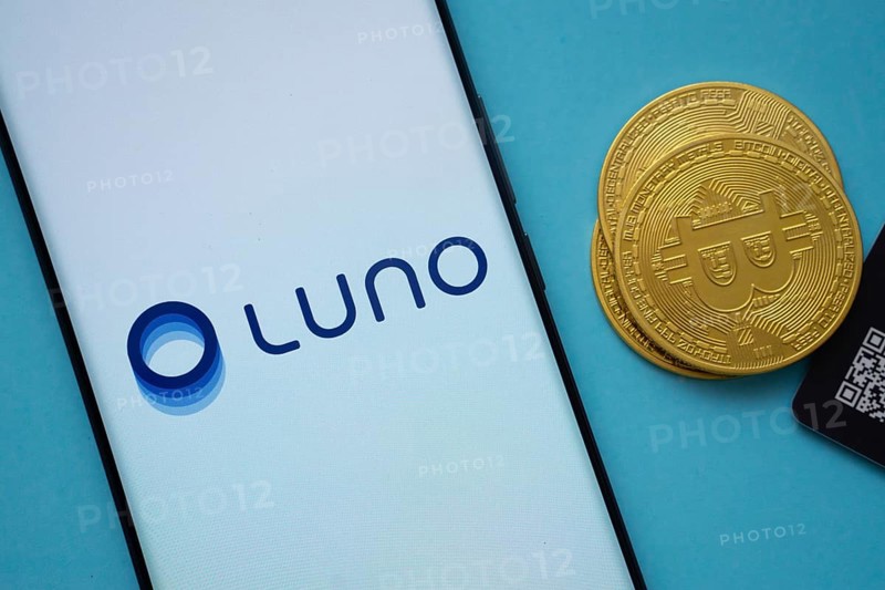Dhaka, Bangladesh- 03 Sep 2025: Luno logo on smartphone screen near Bitcoin coin and QR code on blue background